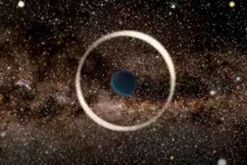 Simulação artística de um evento de microlente gravitacional por um planeta flutuante realizada pelo Observatório Astronômico da Universidade de Varsóvia<!-- NICAID(14630531) -->