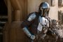The Mandalorian (Pedro Pascal) and the Child in THE MANDALORIAN, season two, exclusively on Disney+<!-- NICAID(14641949) -->