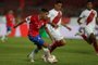  Chiles Cesar Pinares (L) drives the ball during the closed-door 2022 FIFA World Cup South American qualifier football match against Peru at the National Stadium in Santiago, on November 13, 2020. (Photo by IVAN ALVARADO / POOL / AFP)Editoria: SPOLocal: SantiagoIndexador: IVAN ALVARADOSecao: soccerFonte: POOLFotógrafo: STR<!-- NICAID(14642815) -->