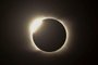 The diamond ring effect is seen during the total solar eclipse from Piedra del Aquila, Neuquen province, Argentina on December 14, 2020. (Photo by RONALDO SCHEMIDT / AFP)<!-- NICAID(14668268) -->