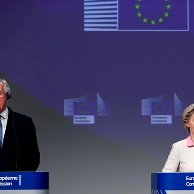 European Commissions Head of Task Force for Relations with the United Kingdom Michel Barnier (L) and European Commission President Ursula von der Leyen (R) attend a media conference on Brexit negotiations at the EU headquarters in Brussels, on December 24, 2020. - Britain said on December 24, 2020, an agreement had been secured on the countrys future relationship with the European Union, after last-gasp talks just days before a cliff-edge deadline. (Photo by Francisco Seco / POOL / AFP)<!-- NICAID(14676621) -->