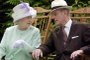 (FILES) In this file photo taken on July 17, 2002 Britains Queen Elizabeth II (L) and Britains Prince Philip, Duke of Edinburgh (R) chat while seated during a musical performance in the Abbey Gardens, Bury St Edmunds, during her Golden Jubilee visit to Suffolk, east of England. - Queen Elizabeth IIs 99-year-old husband Prince Philip, who was recently hospitalised and underwent a successful heart procedure, died on April 9, 2021, Buckingham Palace announced. (Photo by Fiona HANSON / POOL / AFP)<!-- NICAID(14753903) -->