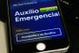 Celular com o aplicativo do axílio emergencial, benefício do governo federal durante a pandemia.<!-- NICAID(14769385) -->