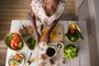 Young African Woman Cooking. Healthy Food - Vegetable Salad. Diet. Dieting Concept. Healthy Lifestyle. Cooking At Home. Prepare Food. Top View (Foto: Milles Studio / stock.adobe.com)Indexador: Kirill KedrinskiyFonte: 77821422<!-- NICAID(14282597) -->