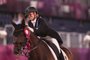 Gold medallist Germanys Jessica von Bredow-Werndl riding TSF Dalera poses after the medal ceremony for the dressage grand prix freestyle individual finals during the Tokyo 2020 Olympic Games at the Equestrian Park in Tokyo on July 28, 2021. (Photo by Julian Finney / POOL / AFP)<!-- NICAID(14846721) -->