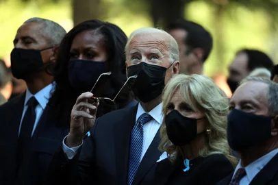 NEW YORK, NEW YORK - SEPTEMBER 11: (L-R) Former President Barack Obama, former First Lady Michelle Obama, President Joe Biden, First Lady Jill Biden and former New York City Mayor Michael Bloomberg attend the annual 9/11 Commemoration Ceremony at the National 9/11 Memorial and Museum on September 11, 2021 in New York City. During the ceremony six moments of silence were held, marking when each of the World Trade Center towers was struck and fell and the times corresponding to the attack on the Pentagon and the crash of Flight 93. The nation is marking the 20th anniversary of the terror attacks of September 11, 2001, when the terrorist group al-Qaeda flew hijacked airplanes into the World Trade Center, Shanksville, PA and the Pentagon, killing nearly 3,000 people.   Chip Somodevilla/Getty Images/AFP (Photo by CHIP SOMODEVILLA / GETTY IMAGES NORTH AMERICA / Getty Images via AFP)<!-- NICAID(14887220) -->