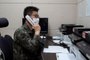 This handout photo taken and provided on October 4, 2021 by South Koreas Defence Ministry in Seoul shows a South Korean military officer speaking over a phone call with a North Korean official at an undisclosed location near the Demilitarized Zone (DMZ) dividing the two Koreas after North and South Korea restored their cross-border communications. (Photo by Handout / South Korean Defence Ministry / AFP) / RESTRICTED TO EDITORIAL USE - MANDATORY CREDIT AFP PHOTO / South Korean Defence Ministry - NO MARKETING NO ADVERTISING CAMPAIGNS - DISTRIBUTED AS A SERVICE TO CLIENTS<!-- NICAID(14905780) -->