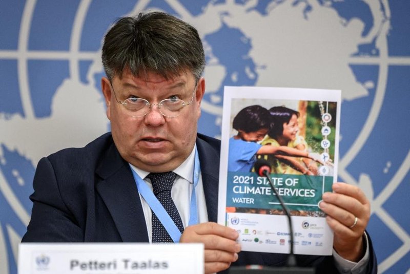 Finnish Secretary-General of the World Meteorological Organization (WMO) Petteri Taalas shows an UN multi-agency report 2021 at the United Nations offices in Geneva on October 5, 2021, during a press conference on water-related problems. - More than five billion people could have difficulty accessing water by 2050, the World Meteorological Organization warned. In 2018, 3.6 billion people did not have sufficient access to water for at least one month, according to a new report by the UN organisation. (Photo by Fabrice COFFRINI / AFP)<!-- NICAID(14906624) -->