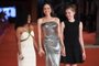 US actress Angelina Jolie arrives with her daughters Zahara Jolie-Pitt (L) and Shiloh Jolie-Pitt (R) for the screening of the film Eternals on October 24, 2021 at the Auditorium Parco della Musica venue in Rome, during the 16th Rome Film Festival. (Photo by Tiziana FABI / AFP)<!-- NICAID(14923875) -->
