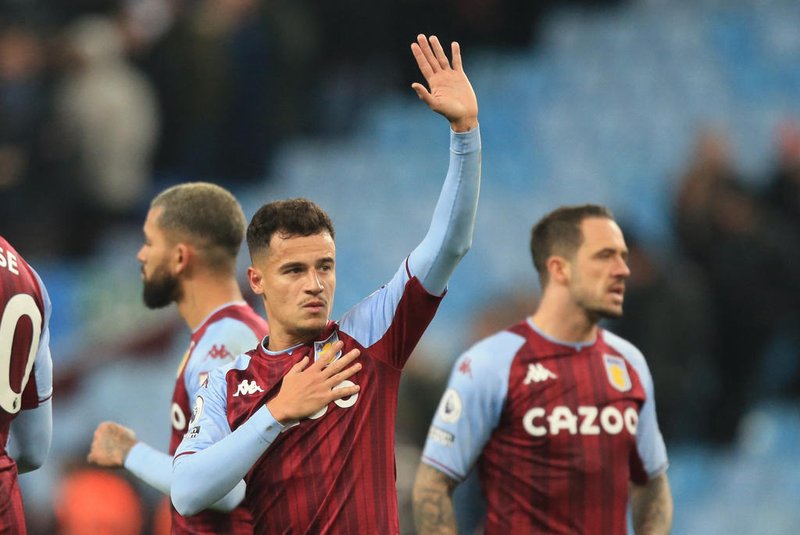 Aston Villas Brazilian midfielder Philippe Coutinho gestures to supporters after the English Premier League football match between Aston Villa and Manchester Utd at Villa Park in Birmingham, central England on January 15, 2022. - The game finished 2-2. (Photo by Lindsey Parnaby / AFP) / RESTRICTED TO EDITORIAL USE. No use with unauthorized audio, video, data, fixture lists, club/league logos or live services. Online in-match use limited to 120 images. An additional 40 images may be used in extra time. No video emulation. Social media in-match use limited to 120 images. An additional 40 images may be used in extra time. No use in betting publications, games or single club/league/player publications. / <!-- NICAID(14990888) -->