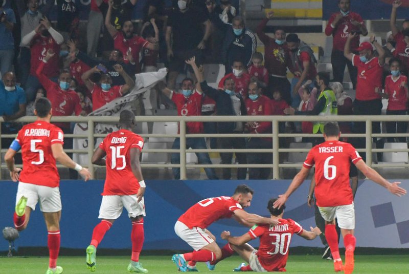 Al-Ahly players celebrate with Ahlys defender Mohamed Hany after he scored the opening goal during the 2021 FIFA Club World Cup football match between Egypts Al-Ahly and Mexicos Monterrey at al-Nahyan Stadium in Abu Dhabi, on February 5, 2022. (Photo by AFP)Editoria: SPOLocal: Abu DhabiIndexador: -Secao: soccerFonte: AFPFotógrafo: STR<!-- NICAID(15008419) -->