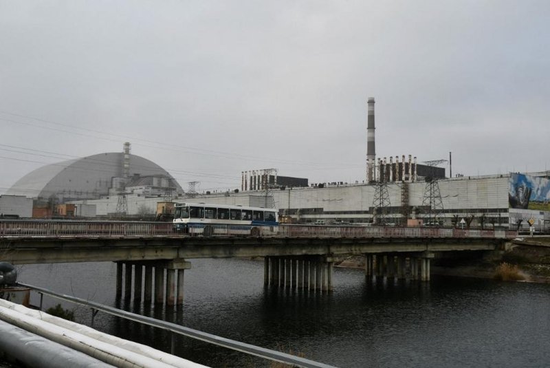(FILES) This file photograph taken on December 8, 2020 shows a general view of Chernobyl nuclear power plant and giant protective dome built over the sarcophagus of the destroyed fourth reactor. - Ukraine announced on February 24 that Russian forces had captured the Chernobyl nuclear power plant after a fierce battle on the first day of the Kremlins invasion of its ex-Soviet neighbour. After the absolutely senseless attack of the Russians in this direction, it is impossible to say that the Chernobyl nuclear power plant is safe. This is one of the most serious threats to Europe today, said Mykhailo Podolyak, advisor to the chief of the presidential administration. (Photo by GENYA SAVILOV / AFP)<!-- NICAID(15026713) -->