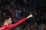 Portugals forward Cristiano Ronaldo (L) waves to supporters at the end of the World Cup 2022 qualifying final first leg football match between Portugal and North Macedonia at the Dragao stadium in Porto on March 29, 2022. -  (Photo by MIGUEL RIOPA / AFP)<!-- NICAID(15064762) -->