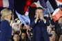 French President and La Republique en Marche (LREM) party candidate for re-election Emmanuel Macron (C-R) applauses next to his wife Brigitte Macron after his victory in Frances presidential election, at the Champ de Mars in Paris, on April 24, 2022. (Photo by Ludovic MARIN / AFP)Editoria: POLLocal: ParisIndexador: LUDOVIC MARINSecao: electionFonte: AFPFotógrafo: STF<!-- NICAID(15076841) -->