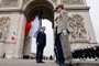 Emmanuel Macron (L) speaks to military officers at the Arc de Triomphe as part of the ceremonies marking the Allied victory against Nazi Germany and the end of World War II in Europe (VE Day), in Paris on May 8, 2022. (Photo by Ludovic MARIN / various sources / AFP)<!-- NICAID(15090331) -->