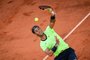 Spains Rafael Nadal serves the ball to Serbias Novak Djokovic during their mens singles semi-final tennis match on Day 13 of The Roland Garros 2021 French Open tennis tournament in Paris on June 11, 2021. (Photo by Anne-Christine POUJOULAT / AFP)Editoria: SPOLocal: ParisIndexador: ANNE-CHRISTINE POUJOULATSecao: tennisFonte: AFPFotógrafo: STF<!-- NICAID(14807363) -->
