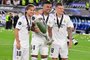 Real Madrids Croatian midfielder Luka Modric (L-R) Real Madrids Brazilian midfielder Casemiro and Real Madrids German midfielder Toni Kroos celebrate with the trophy after the UEFA Super Cup football match between Real Madrid vs Eintracht Frankfurt in Helsinki, on August 10, 2022. - Real Madrid won the match 2-0. (Photo by JAVIER SORIANO / AFP)<!-- NICAID(15171984) -->