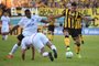 Uruguays Penarol forward Gabriel Matias Fernandez (R) vies for the ball with Uruguays Nacional defender Luis Felipe Carvalho (L) and Uruguays Nacional midfielder Paulo Matias Zunino during the Uruguayan Apertura 2019 tournament football match at the Campeon del Siglo stadium in Montevideo on May 11, 2019. (Photo by MIGUEL ROJO / AFP)<!-- NICAID(14078068) -->