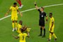 Italian referee Daniele Orsato (2nd R) shows a yellow card to Qatars midfielder Karim Boudiaf (out of frame) as Ecuadors forward Enner Valencia  (2nd L) lies on the pitch during the Qatar 2022 World Cup Group A football match between Qatar and Ecuador at the Al-Bayt Stadium in Al Khor, north of Doha on November 20, 2022. (Photo by Odd ANDERSEN / AFP)Editoria: SPOLocal: Al KhorIndexador: ODD ANDERSENSecao: soccerFonte: AFPFotógrafo: STF<!-- NICAID(15270588) -->