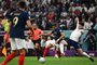 Frances forward #10 Kylian Mbappe (C) is challenged by Englands midfielder #04 Declan Rice during the Qatar 2022 World Cup quarter-final football match between England and France at the Al-Bayt Stadium in Al Khor, north of Doha, on December 10, 2022. (Photo by Anne-Christine POUJOULAT / AFP)Editoria: SPOLocal: Al KhorIndexador: ANNE-CHRISTINE POUJOULATSecao: soccerFonte: AFPFotógrafo: STF<!-- NICAID(15292143) -->
