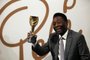 Former Brazilian footballer Pele holds a replica Jules Rimet trophy, a trophy awarded to the winner of the football World Cup, during an media interview at a preview for an auction of his memorabilia in London on June 1, 2016. - The three-time World Cup winner and FIFA Player of the Century is offering to auction his vast memorabilia collection including awards, personal property and iconic items from his entire career. The collection is being offered by Juliens Auction House on June 7, 8, 9 in London. (Photo by ADRIAN DENNIS / AFP)Editoria: HUMLocal: LondonIndexador: ADRIAN DENNISSecao: soccerFonte: AFPFotógrafo: STR<!-- NICAID(15304068) -->