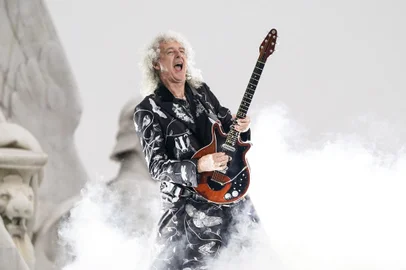 (FILES) In this file photo taken on June 4, 2022 British guitarist Brian May of Queen performs during the Platinum Party at Buckingham Palace as part of Queen Elizabeth IIs platinum jubilee celebrations. - Brian May, guitarist of the rock band Queen, is one of 1,107 people who have been awarded this year in a list signed for the first time by King Charles III. These royal awards are given twice a year, on New Years Day and on the Kings official birthday, always celebrated in June, regardless of the monarchs actual date of birth (14 November 1948 for Charles III). (Photo by Alberto Pezzali / POOL / AFP)<!-- NICAID(15309989) -->