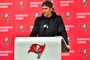TAMPA, FLORIDA - JANUARY 16: Tom Brady #12 of the Tampa Bay Buccaneers speaks to the media after losing to the Dallas Cowboys 31-14 in the NFC Wild Card playoff game at Raymond James Stadium on January 16, 2023 in Tampa, Florida.   Julio Aguilar/Getty Images/AFP <!-- NICAID(15323265) -->