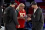 PHOENIX, ARIZONA - FEBRUARY 06: Mother Donna Kelce (C) gives cookies to her sons Jason Kelce (L) #62 of the Philadelphia Eagles and Travis Kelce (R) #87 of the Kansas City Chiefs during Super Bowl LVII Opening Night presented by Fast Twitch at Footprint Center on February 06, 2023 in Phoenix, Arizona.  <!-- NICAID(15342367) -->
